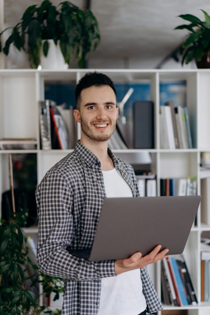 Young entrepreneur using laptop to implement AI Business Automation Services